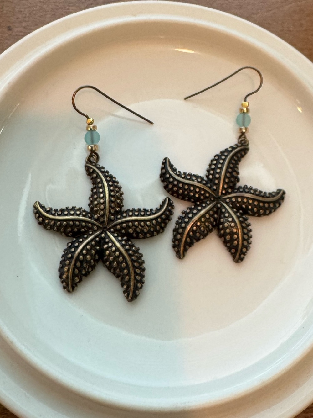 Antique Bronze Starfish Dangle Earrings with Aqua Bead Accents
